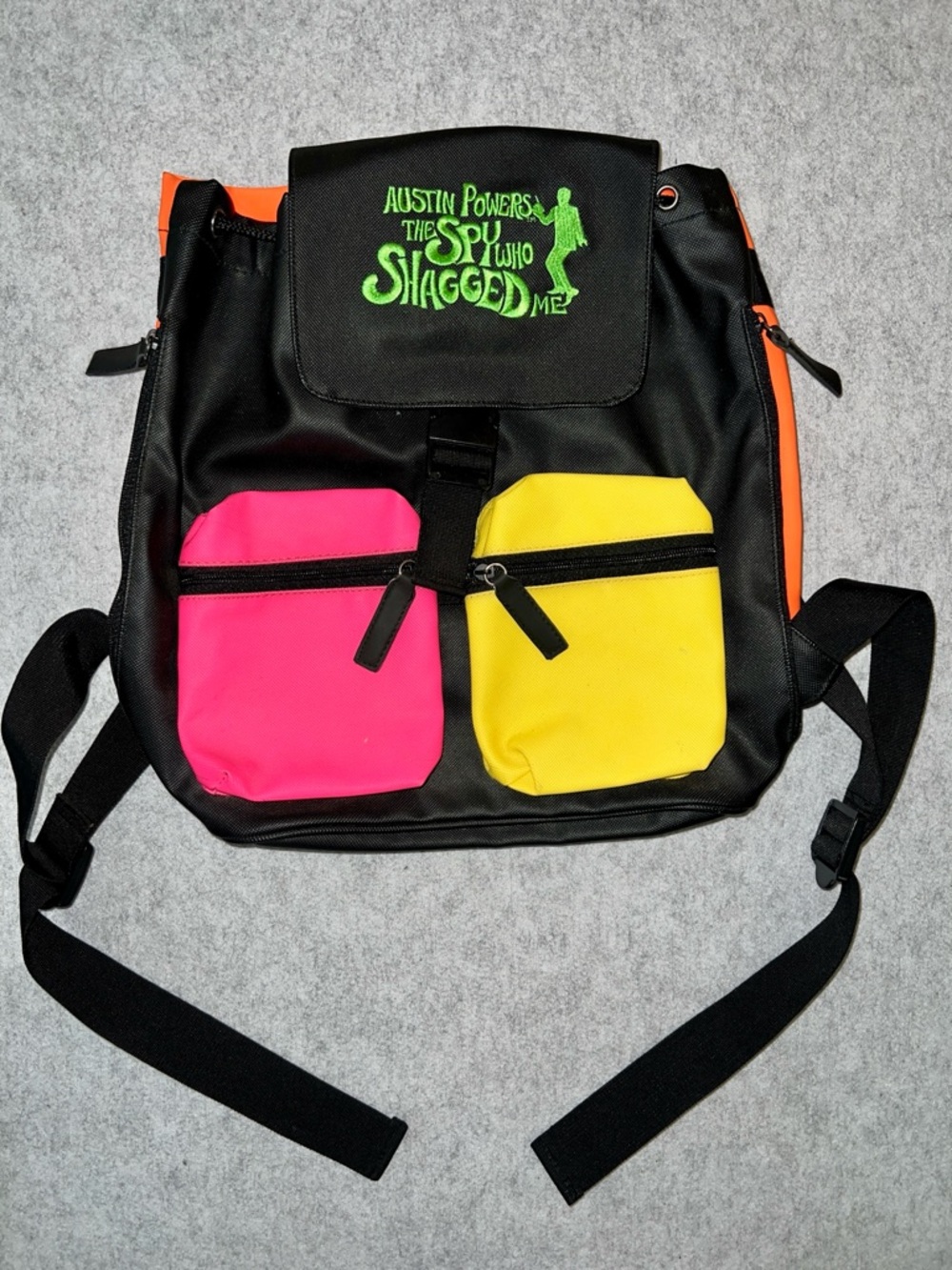 Austin Powers Graphic Black Backpack with Pink & Yellow Pockets
